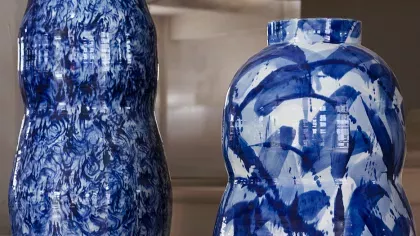 Two monumental porcelain pots glazed in blue and white patterns.