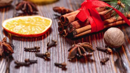 Orange slice, cinnamon sticks, nutmeg, cloves and star anise