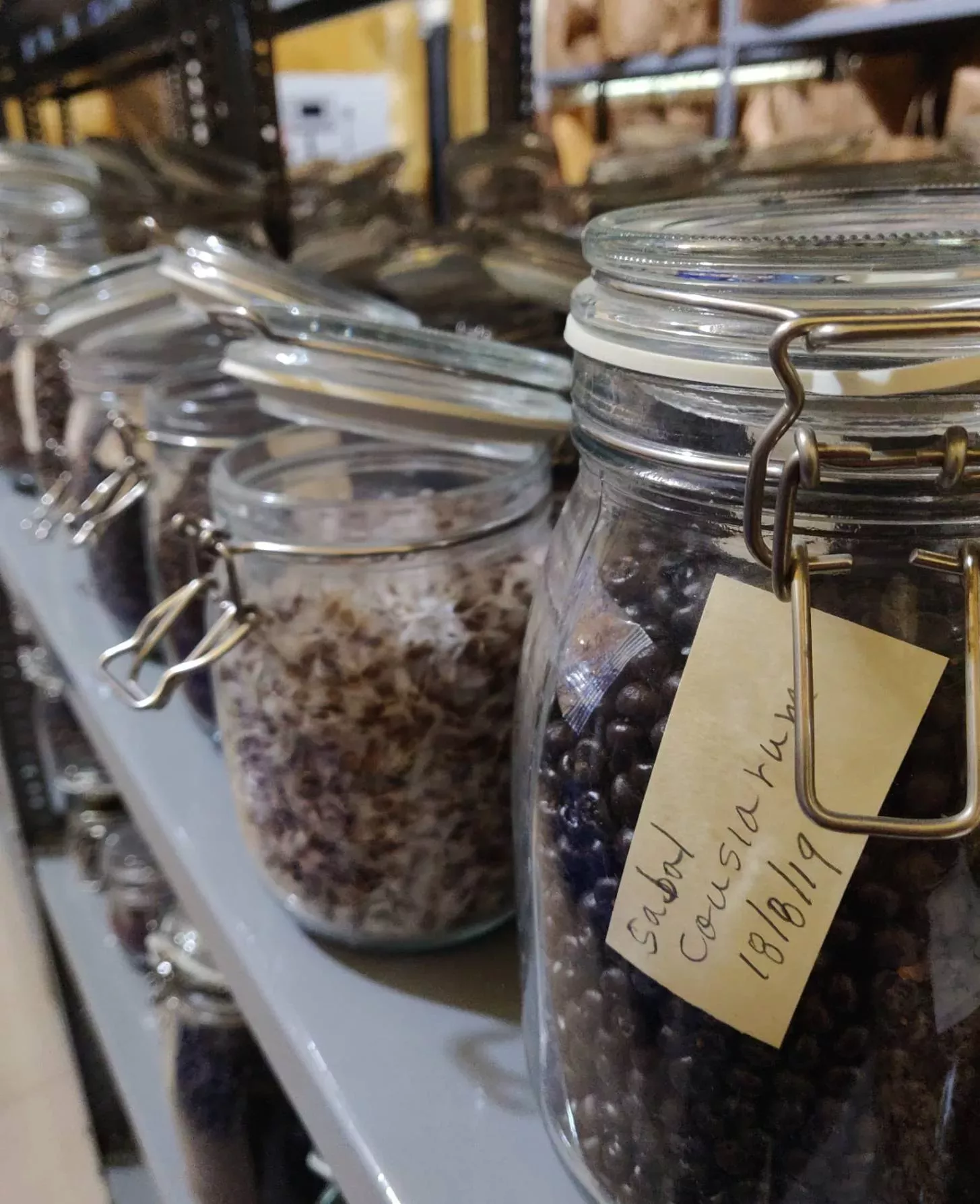 A close-up of mason jars filled with seeds A close-up of mason jars filled with seeds