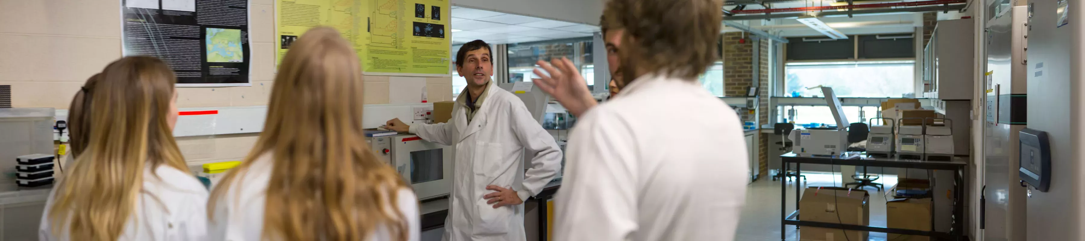 Group of students in a lab on a tour Group of students in a lab on a tour