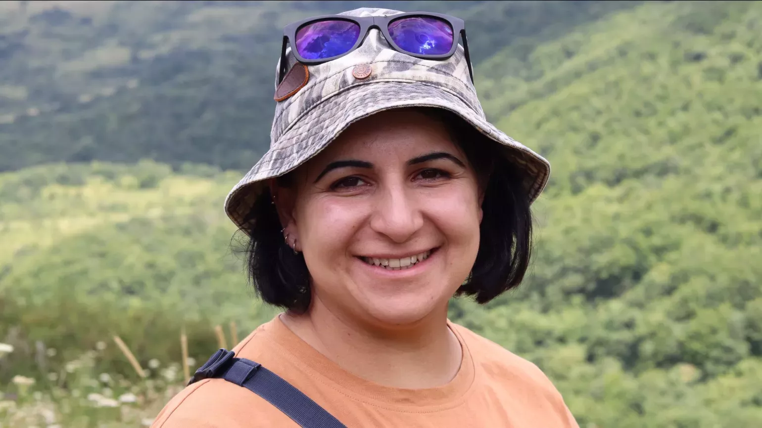 Armenian botanist Sona Galstyan shared her passion for the traditional uses of plants across the country, Lydia Shellien-Walker © RBG Kew A person smiling in a meadow