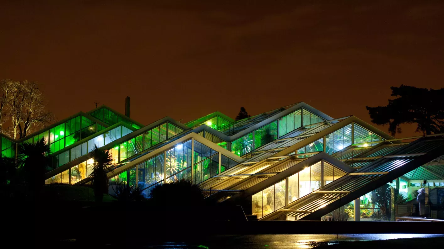 Princess of Wales Conservatory illuminated at night