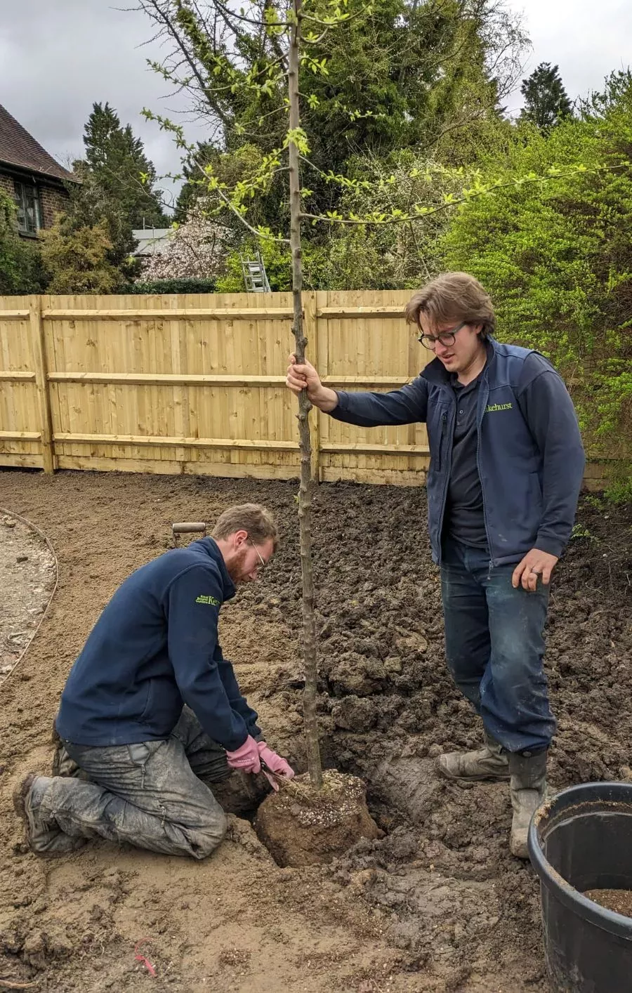 Wakehurst Children's & Community Garden © RBG Kew Two horticulturists planting a young tree